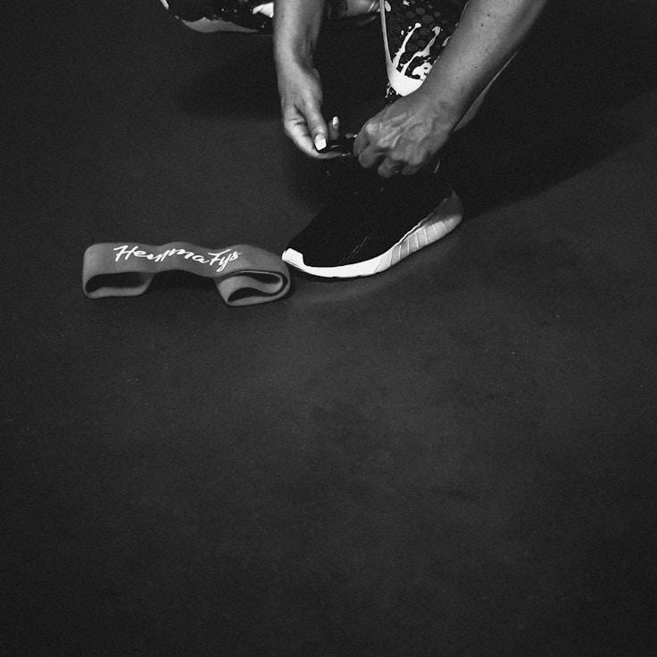 Women in a fitness class doing stretching and mobility exercises